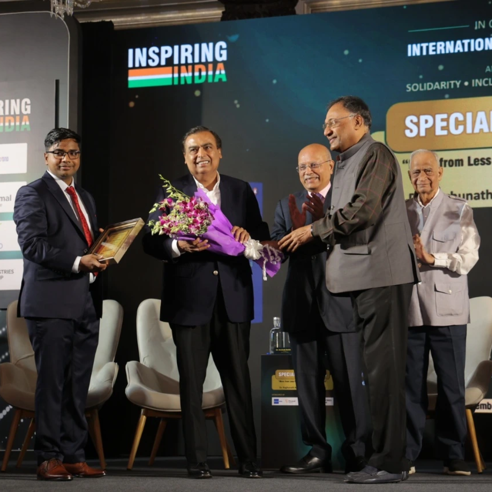 Mr. Niraj Bajaj, Chairman of Bajaj Auto Limited, and Mr. Alok Ranjan Tiwari, Managing Director & CEO of Eternal Corporate Media Private Limited, welcoming and felicitating the Guest of Honour, Mr. Mukesh Ambani, Chairman & Managing Director, Reliance Industries Limited.